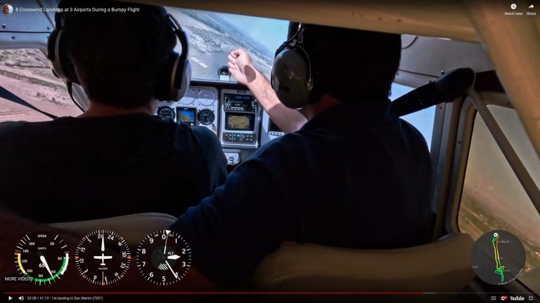 Student pilot and instructor sitting in cockpit with view of runway below